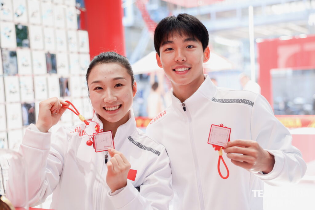 Athletes posing with the TEAM CHINA Merchandise