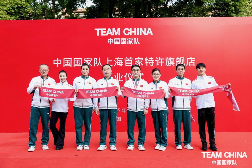 From left to right: Li Tong, co-CEO of Hui10 Inc.; Feng Lei, world aerobics champion; Zhang Ning, Olympic Gold (badminton); Yu Jianyong, Director and Party Secretary of the General Administration of Sport of China and Chinese Olympic Committee; Lu Lin, Deputy Director of the Shanghai Municipal Sports Bureau; Wang Bingyu, world curling champion and Olympic medallist; Zhang Haokai, Director General of China Sports Lottery Hebei; and Liang Wenjie, senior executive of Hui10 Inc. — the eight ribbon‑cutting guests officiating at the opening of the new landmark store in Shanghai.